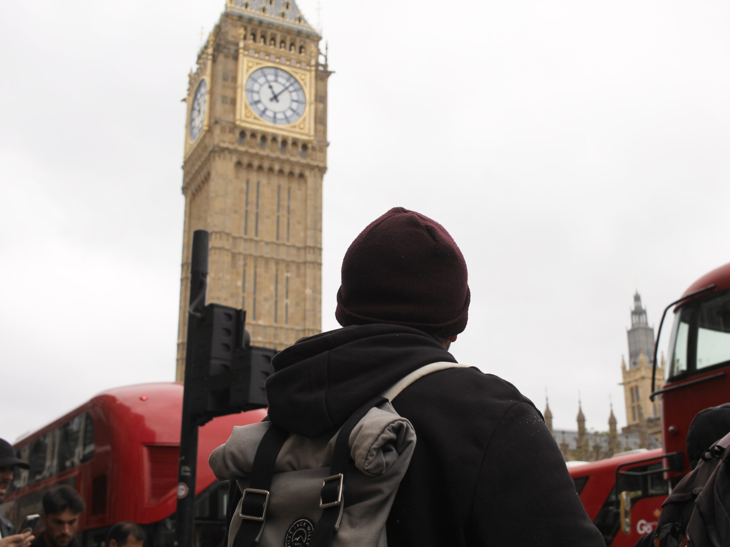 A young person with Big Ben in the background