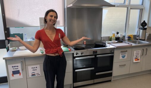 CTS Volunteer posing and smiling in our day centre's kitchen