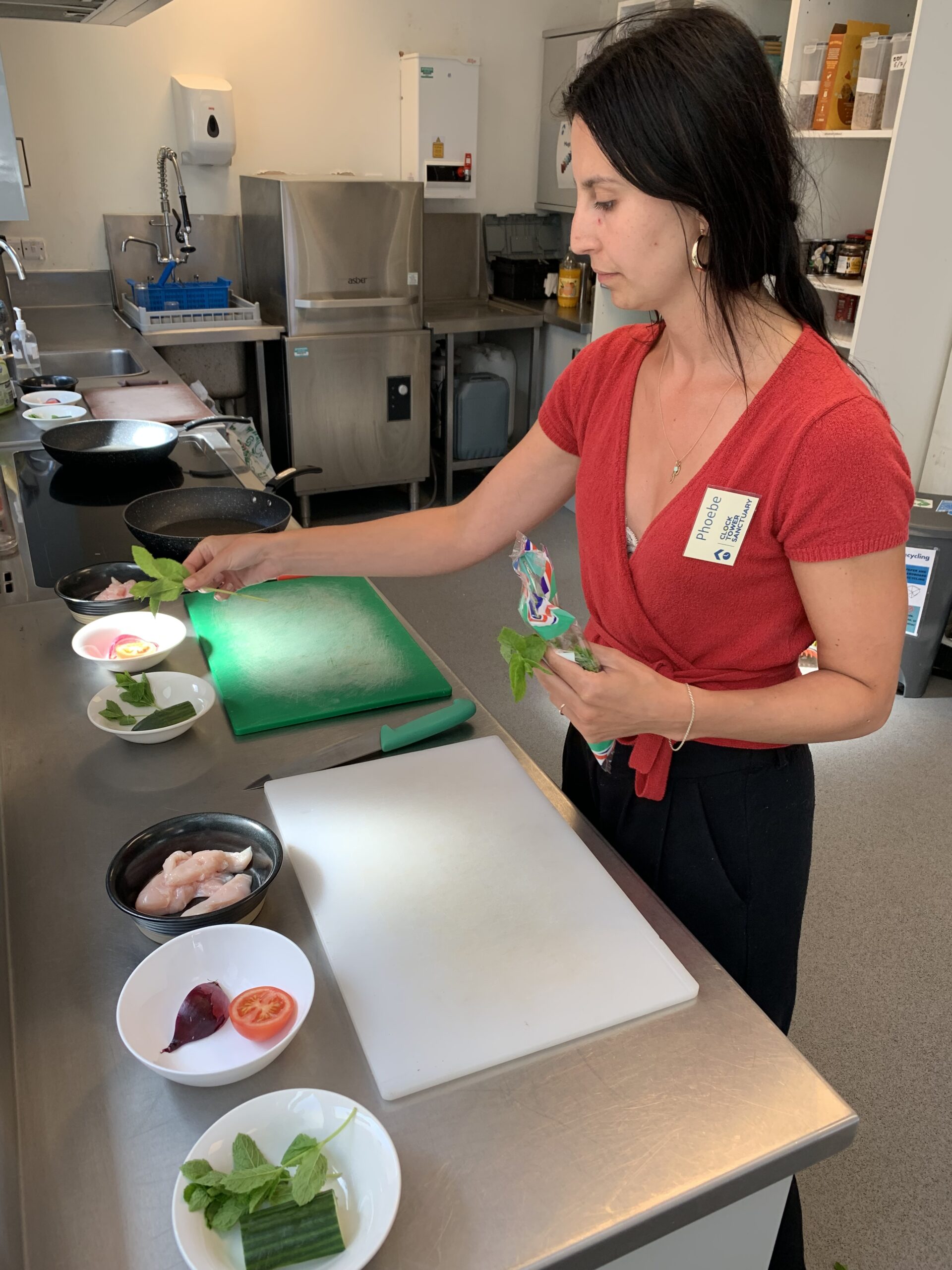 CTS volunteer Phoebe preparing food in our day centre's kitchen